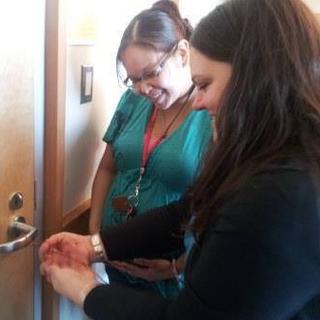 ANTH111 cedar workshop, Nadine showing Rozanne how to twine