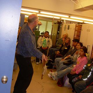 Look out! Grant Keddie from the Royal BC Museum demonstrates the use of an atlatl to students of ANTH 121 (Aboriginal Peoples and Cultures in Canada).