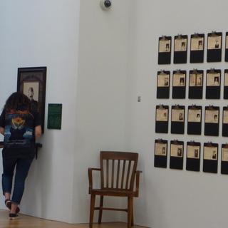 ANTH 390E field trip to the Chinese Canadian Museum.  Two students looking at documentation of individuals.
